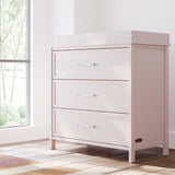 classic blush 3 drawer chest with changing topper in nursery by window