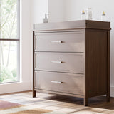 classic hazelnut 3 drawer chest with changing topper in nursery by window