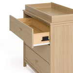 Olivia driftwood 3 drawer chest with changing topper with top drawer open showing interlocking drawer mechanism