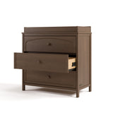 Olivia hazelnut 3 drawer chest with changing topper with middle drawer open angle view