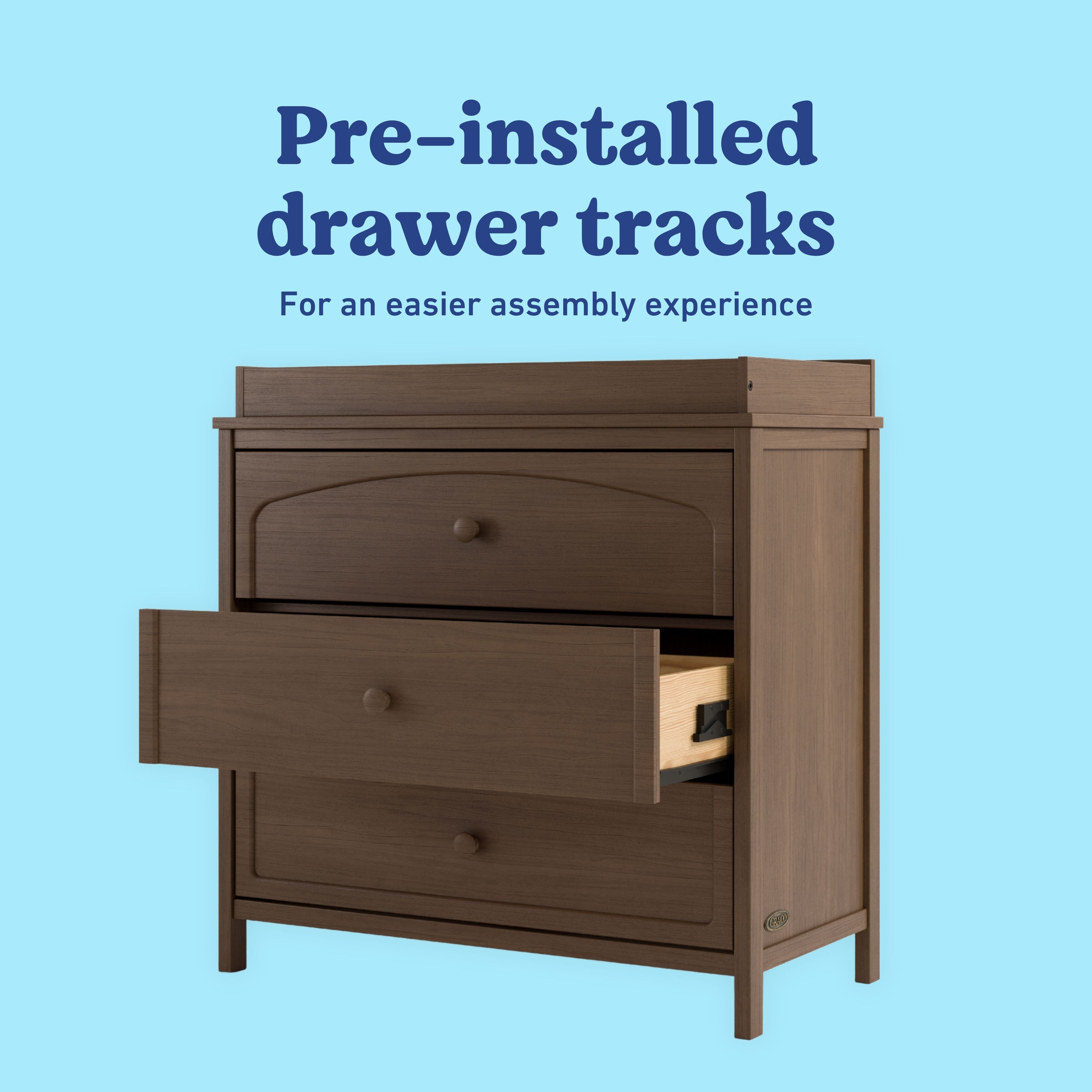 Olivia hazelnut 3 drawer chest with changing topper pre-installed tracks callout
