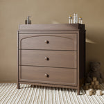 Olivia hazelnut 3 drawer chest with changing topper in a nursery