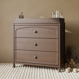 Olivia hazelnut 3 drawer chest with changing topper in a nursery
