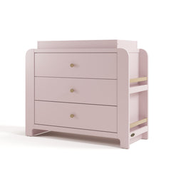 Angle view of Read-with-Me 3 drawer chest with bookshelves and changing topper in blush with driftwood