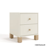 California frosted oat and driftwood 2 drawer nightstand angle view with 2025 Storkcraft copyright on bottom right