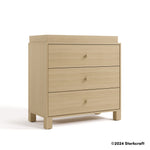 California driftwood 3 drawer chest with topper angle view with Storkcraft 2024 copyright on bottom right