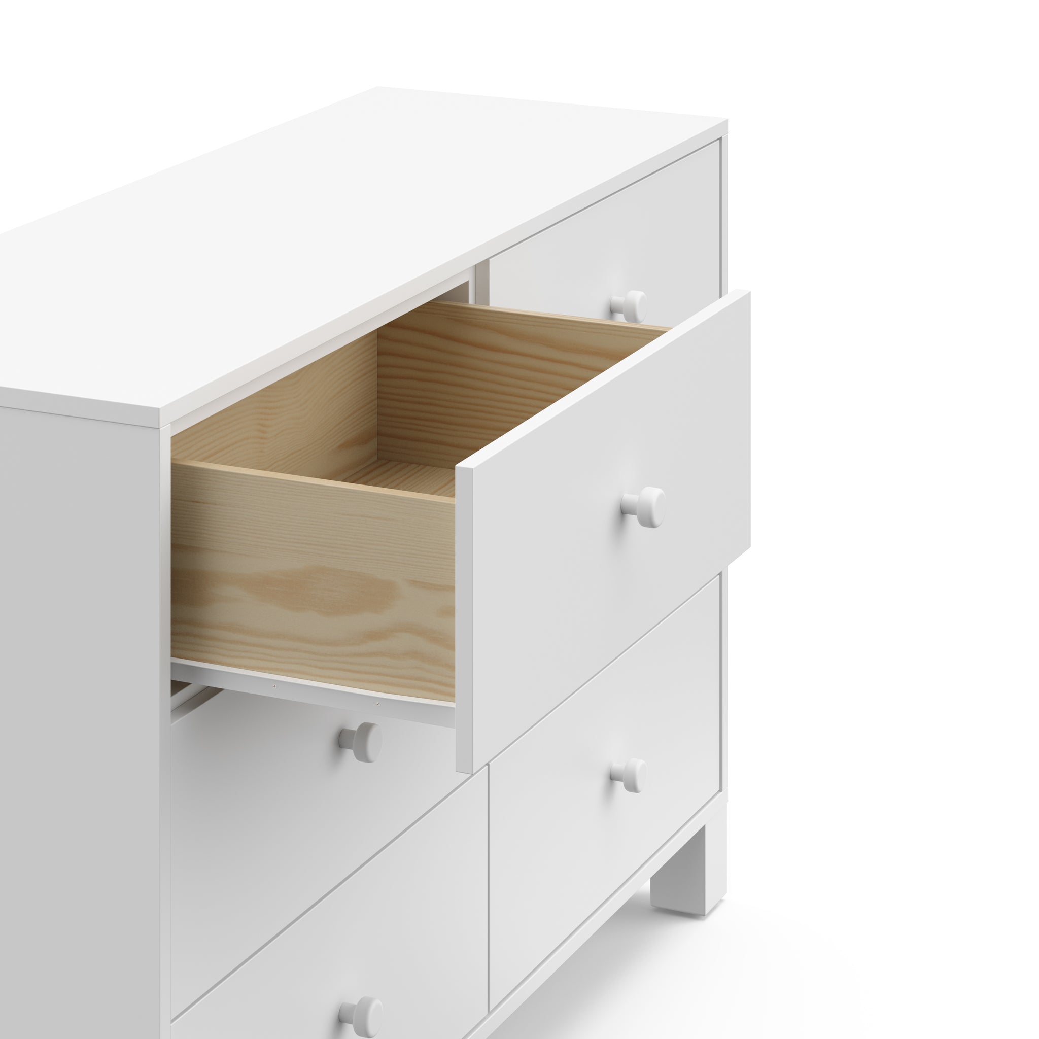 Angled view of white dresser with one open drawer