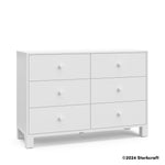 California white 6 drawer dresser angle view with Storkcraft 2024 copyright on bottom right