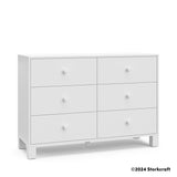 California white 6 drawer dresser angle view with Storkcraft 2024 copyright on bottom right
