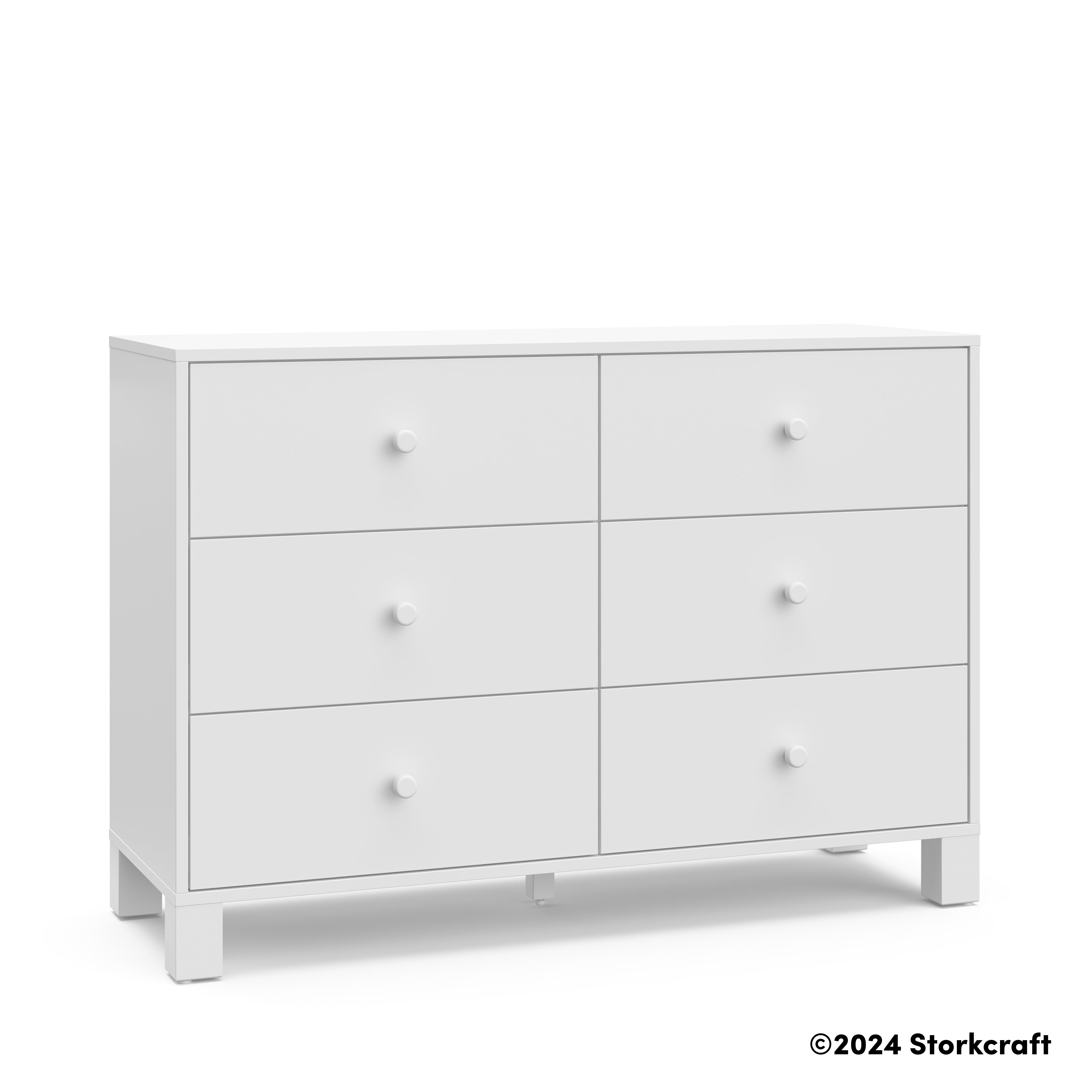 California white 6 drawer dresser angle view with Storkcraft 2024 copyright on bottom right