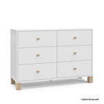 California white with driftwood 6 drawer dresser with 2024 Storkcraft copyright on bottom right