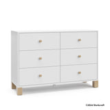 California white with driftwood 6 drawer dresser with 2024 Storkcraft copyright on bottom right