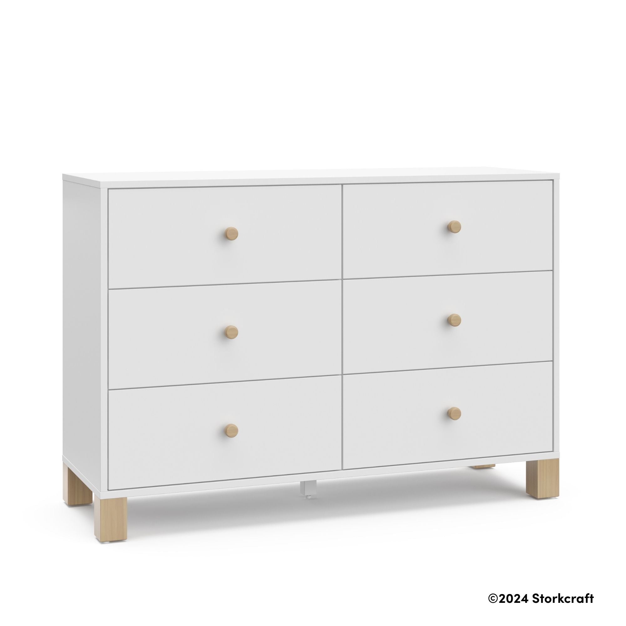 California white with driftwood 6 drawer dresser with 2024 Storkcraft copyright on bottom right