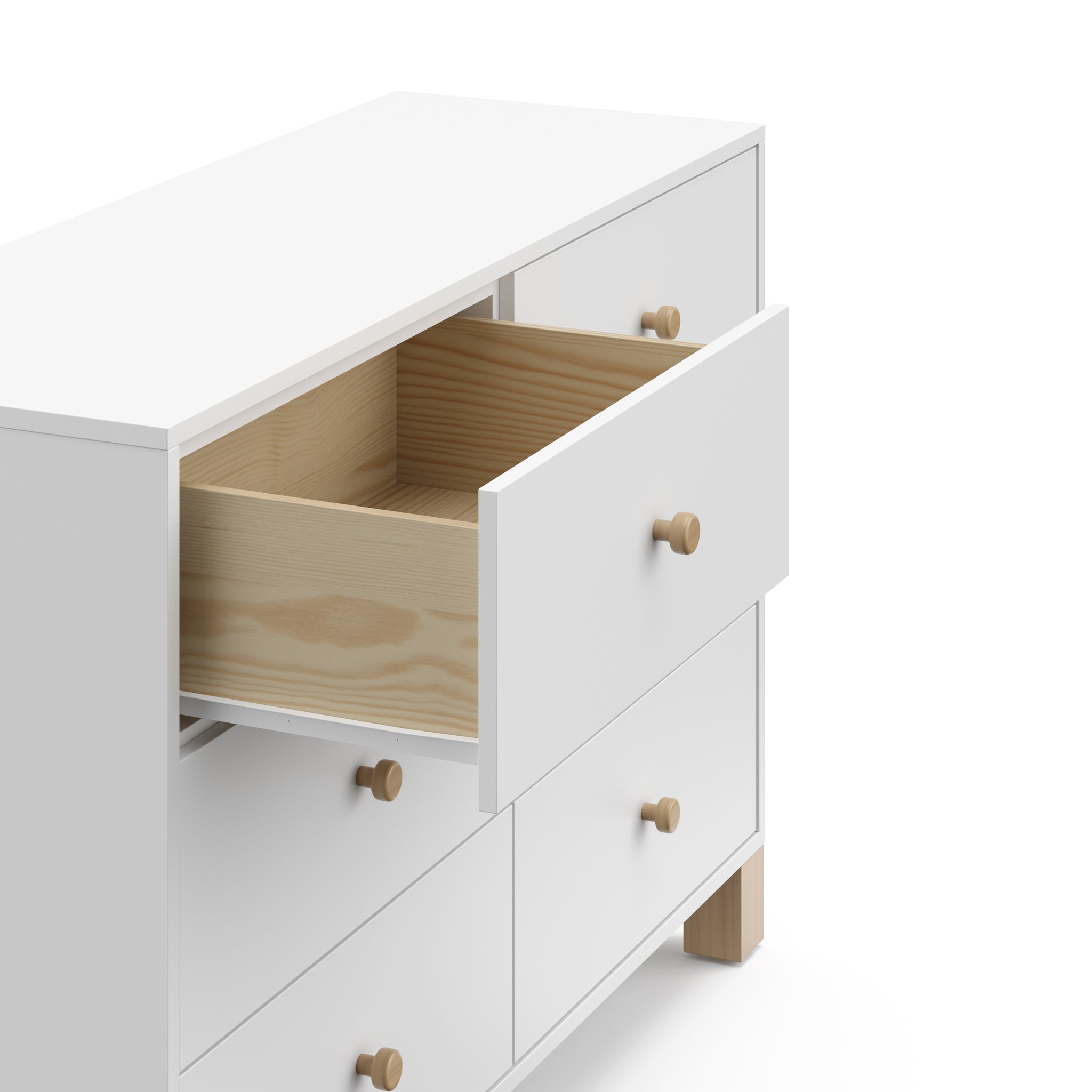 Angled view of white dresser with driftwood knobs and one drawer open