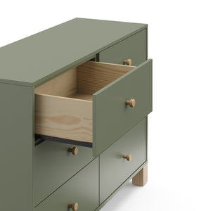Angled view of olive dresser with driftwood knobs and one drawer open