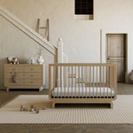 Santorini driftwood 6 drawer dresser in nursery next to Santorini crib