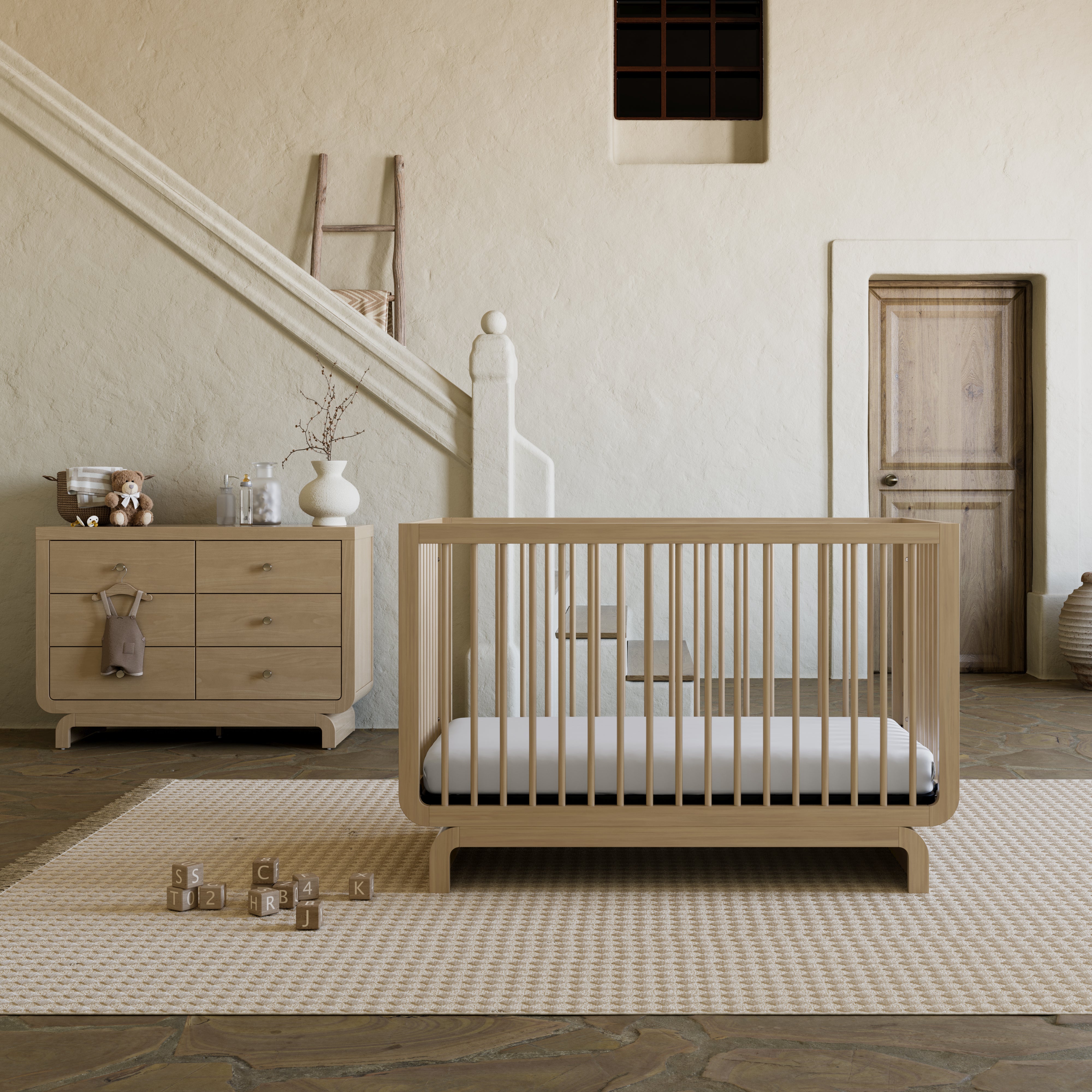 Santorini driftwood 6 drawer dresser in nursery next to Santorini crib