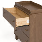 Texas hazelnut 3 drawer chest with changing topper and top drawer open