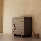 Texas hazelnut 3 drawer chest with topper in a nursery
