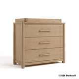 Malta driftwood 3 drawer chest with changing topper angle view and 2026 Storkcraft copyright on bottom right