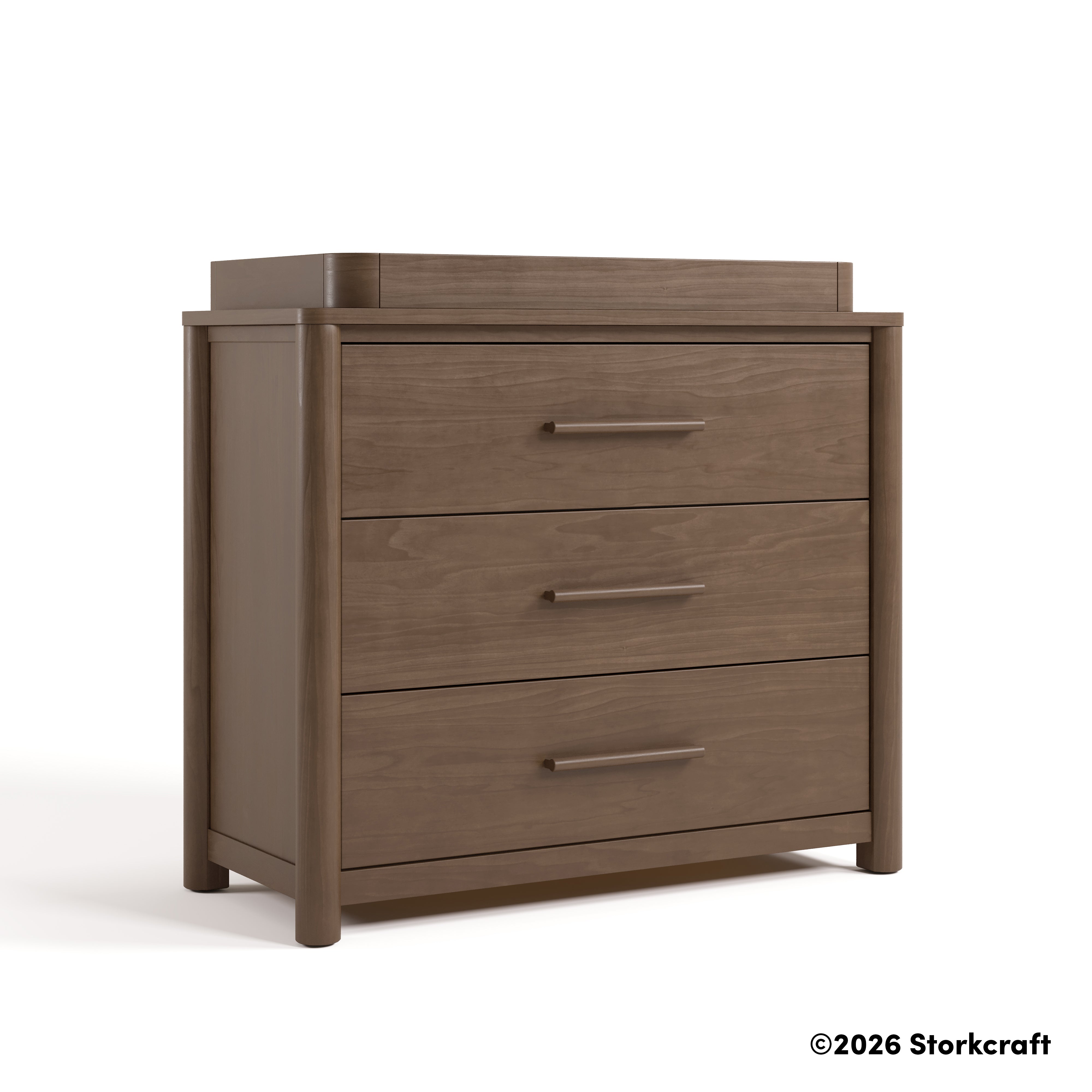 Malta hazelnut 3 drawer chest with changing topper angle view and 2026 Storkcraft copyright on bottom right