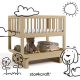Santorini driftwood bassinet with black doodles overlaid on image