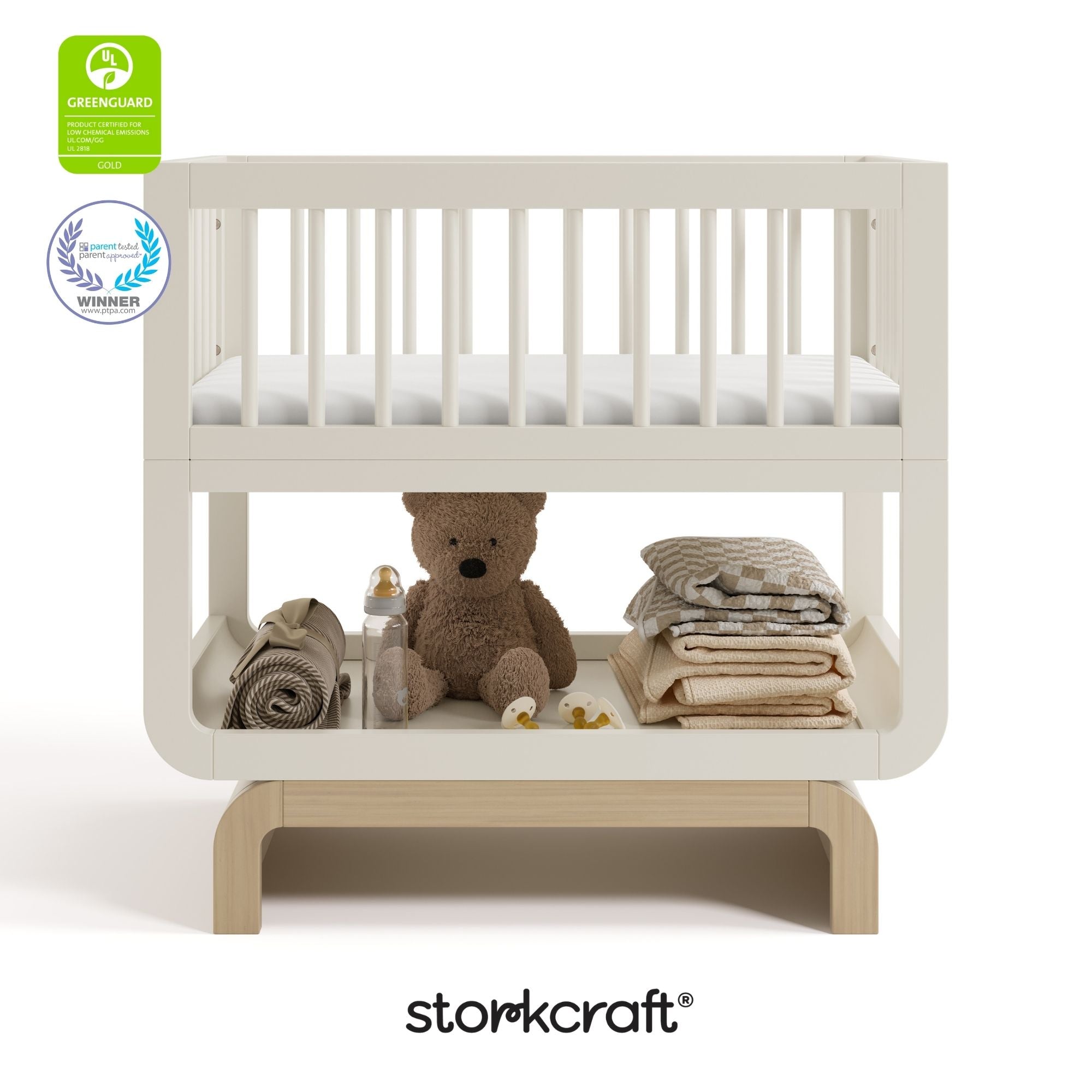 Santorini frosted oat with driftwood bassinet with GGG and PTPA logo on top left