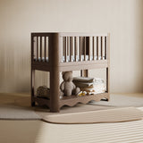 Casablanca hazelnut bassinet in a nursery