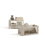 Casablanca frosted oat bassinet converted to toy box and bookcase with baby items inside
