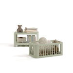 Casablanca sage bassinet converted to toy box and bookcase with baby items inside