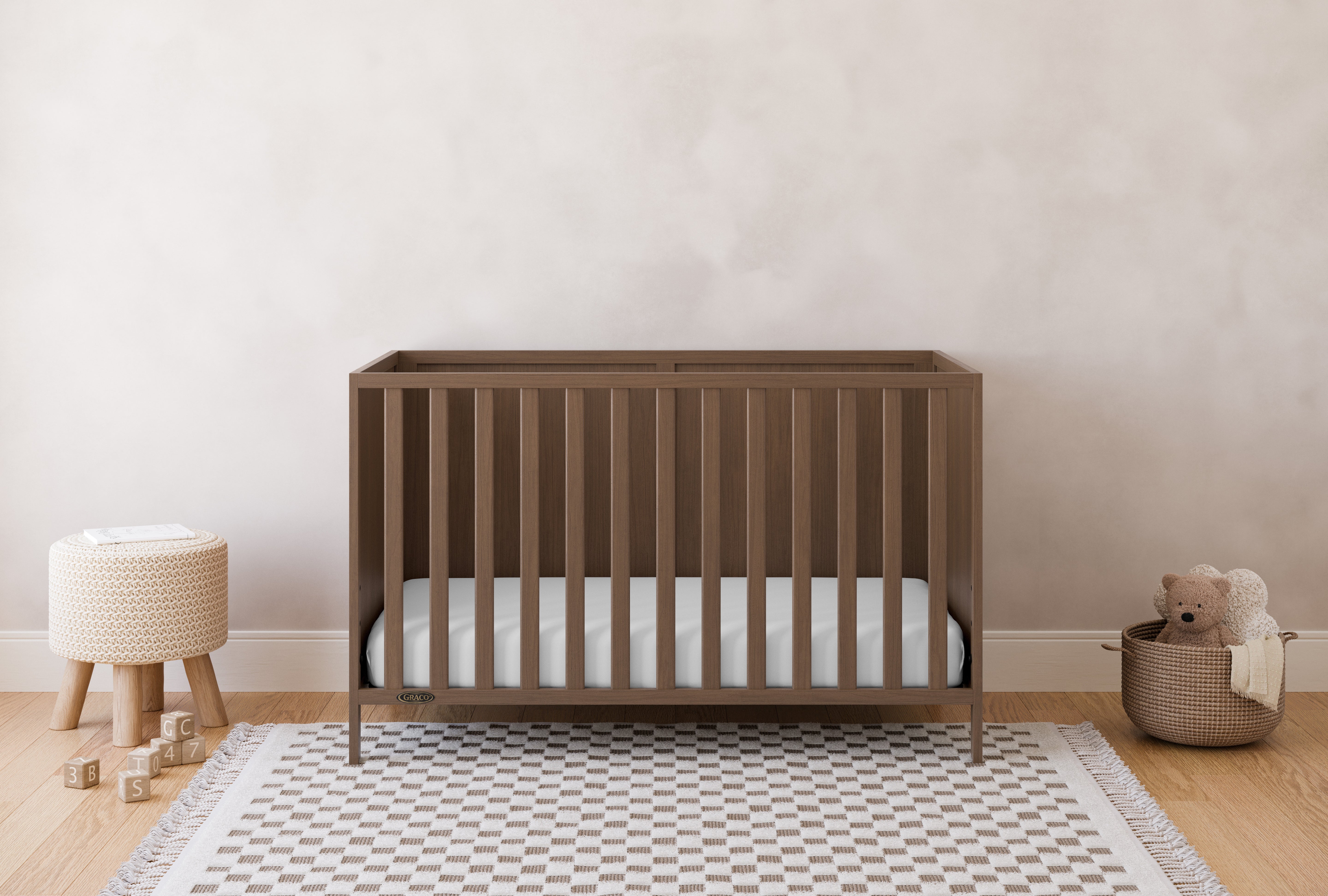 Theo hazelnut crib in a nursery