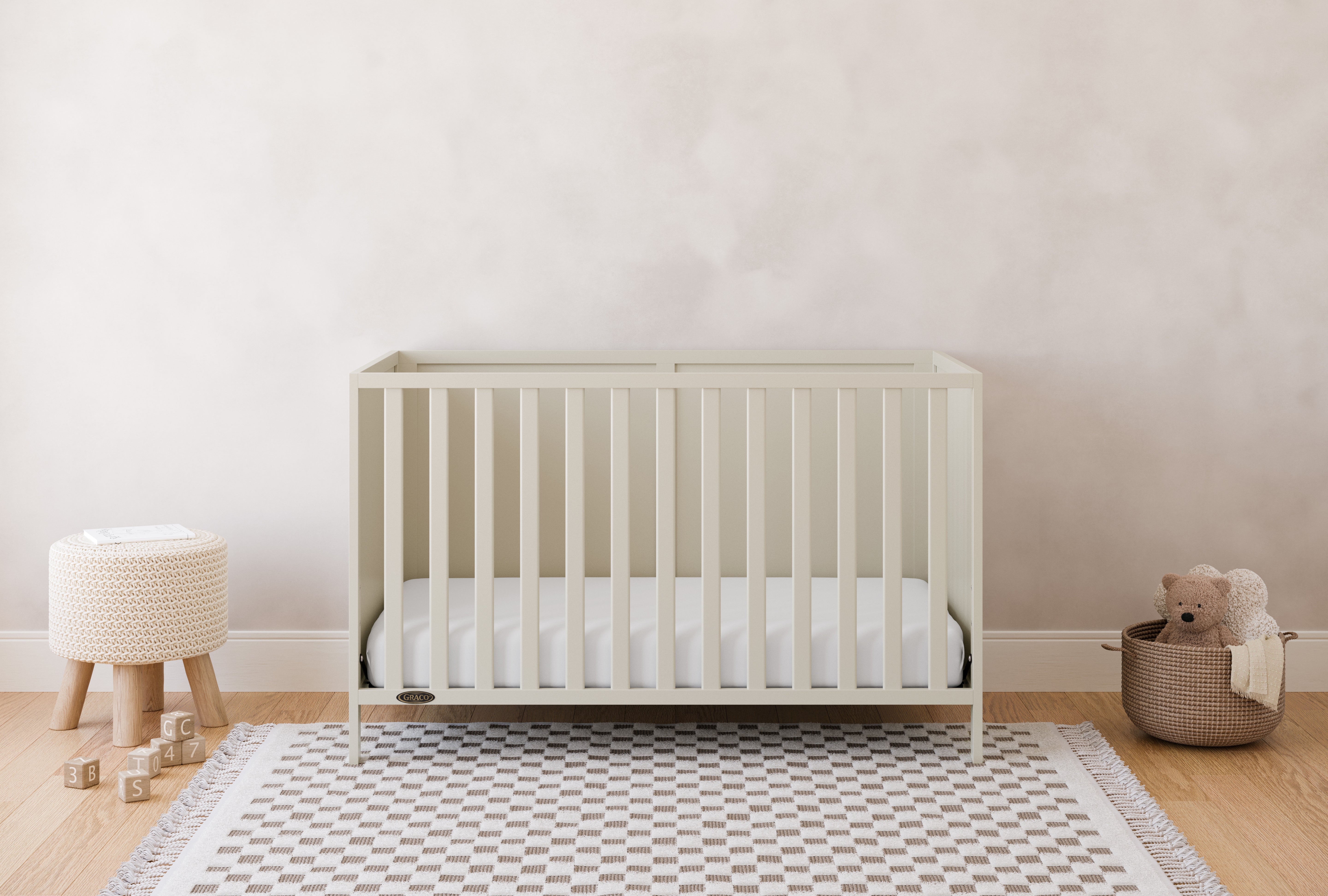 Theo frosted oat crib in a nursery