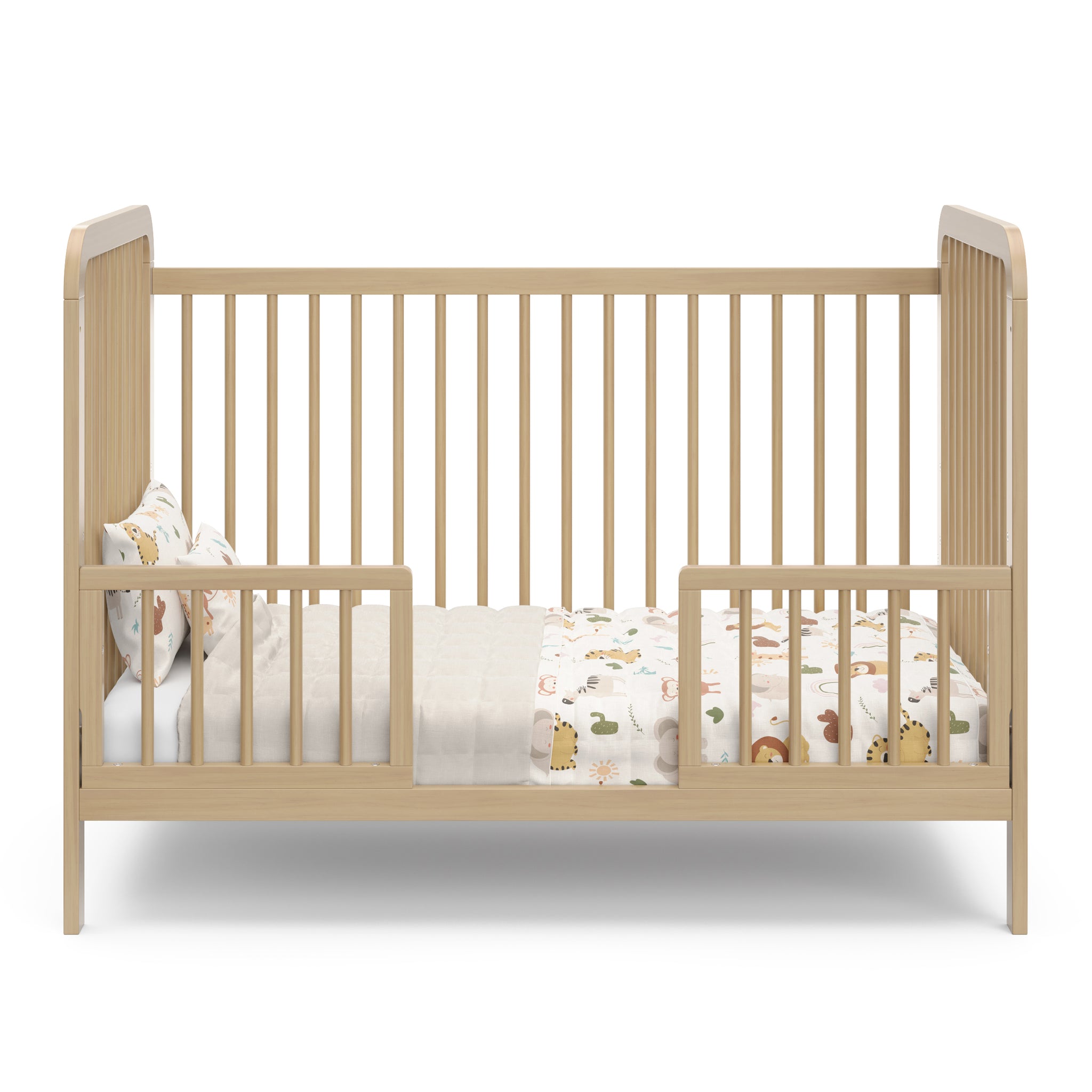 Driftwood crib in toddler bed conversion with two guardrails