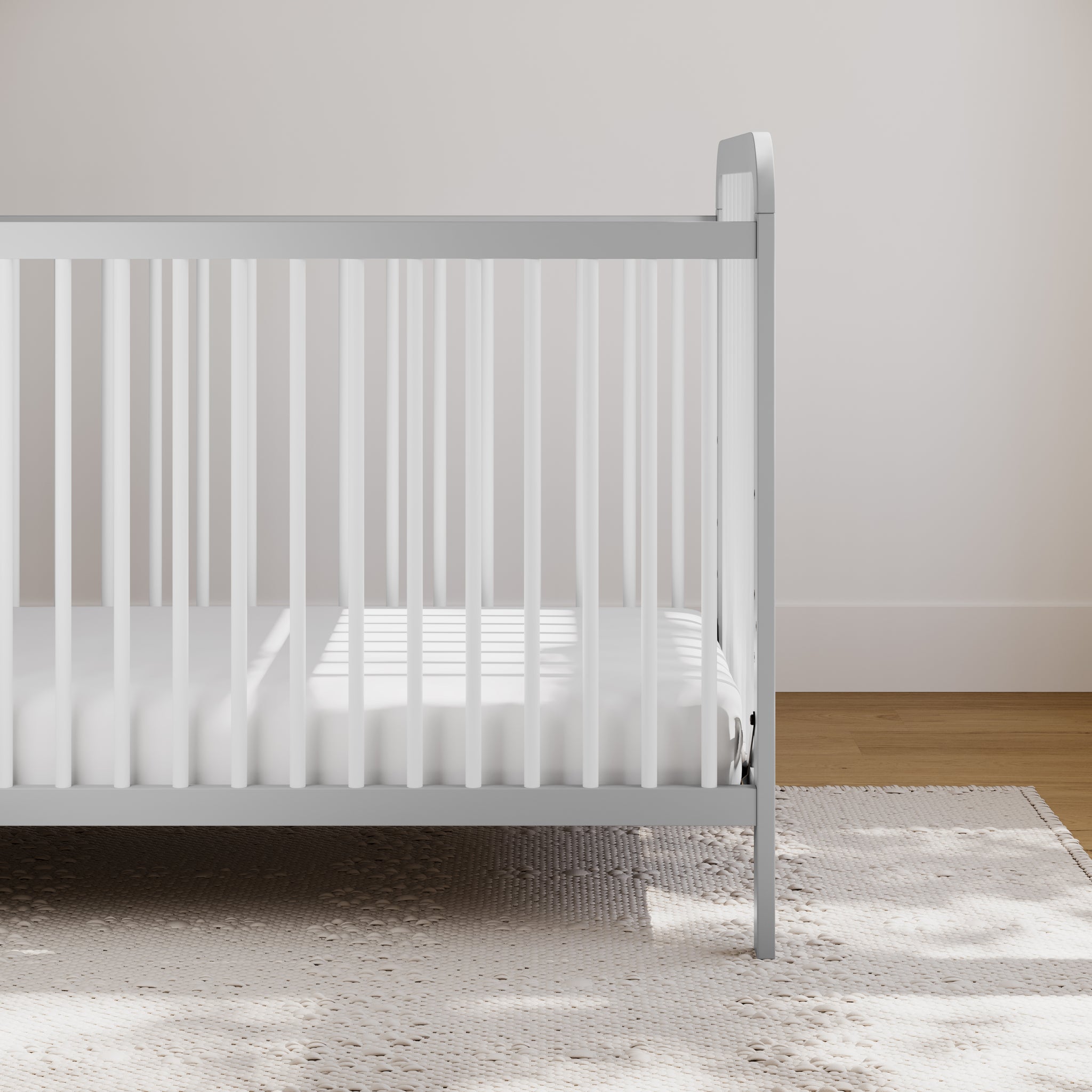 pebble gray with white crib in nursery