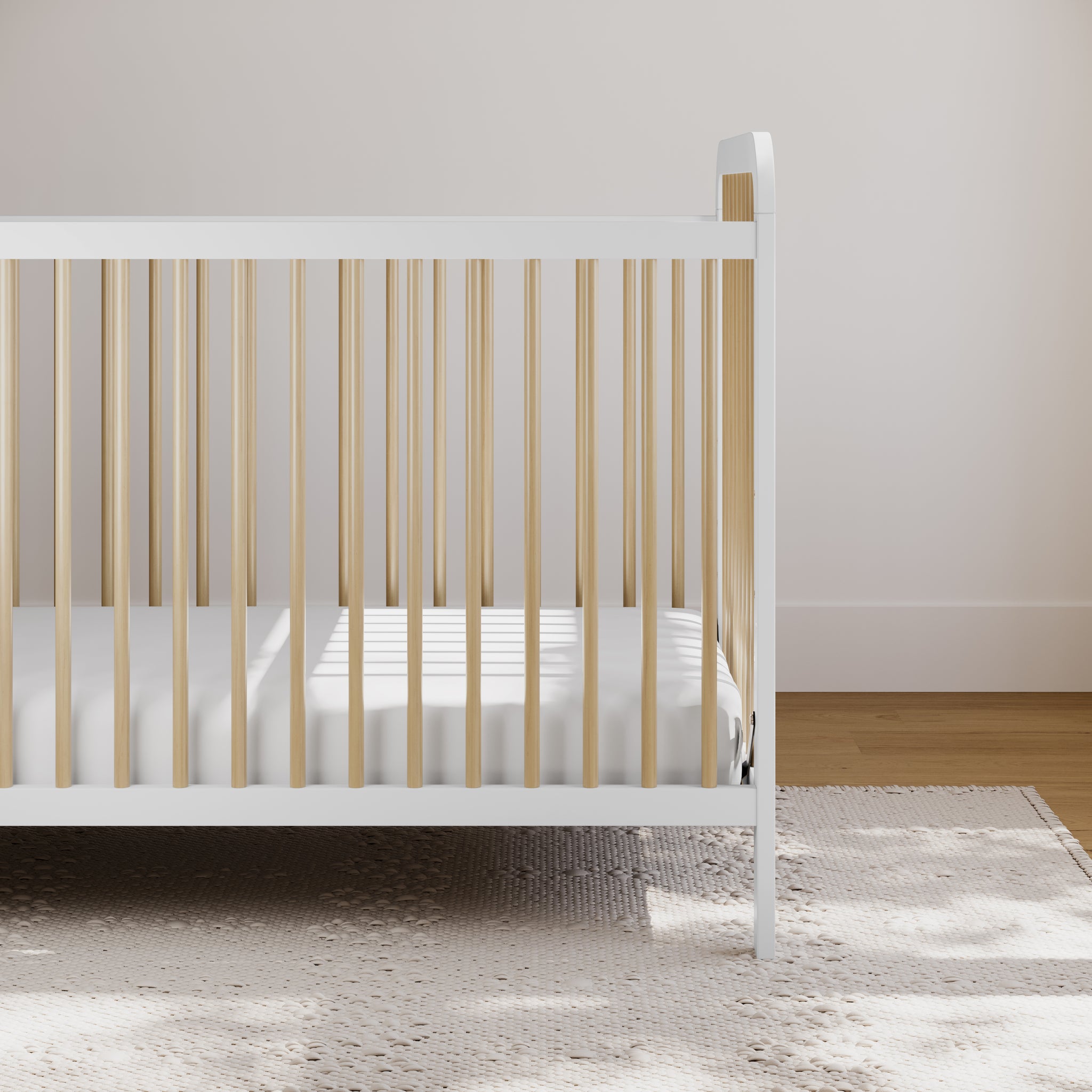 White with driftwood crib in nursery