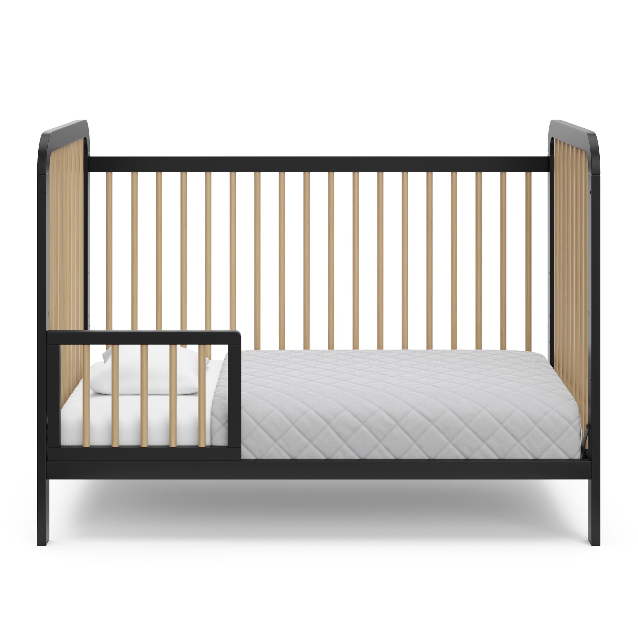 Black with driftwood crib in toddler bed conversion with one guardrail