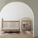 Olivia driftwood crib in a nursery next to changing table