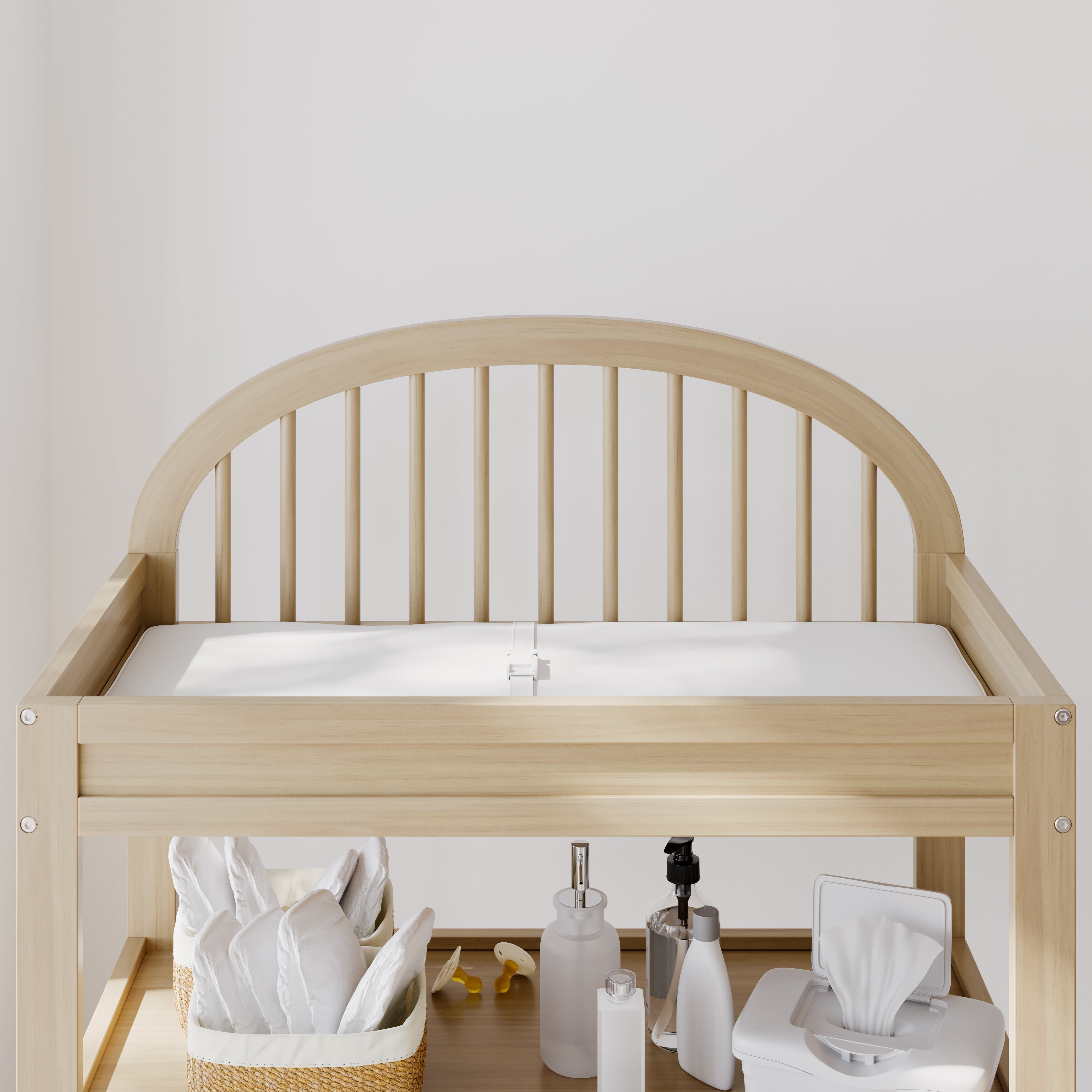 Olivia driftwood changing table close up of headboard with baby items on top shelf
