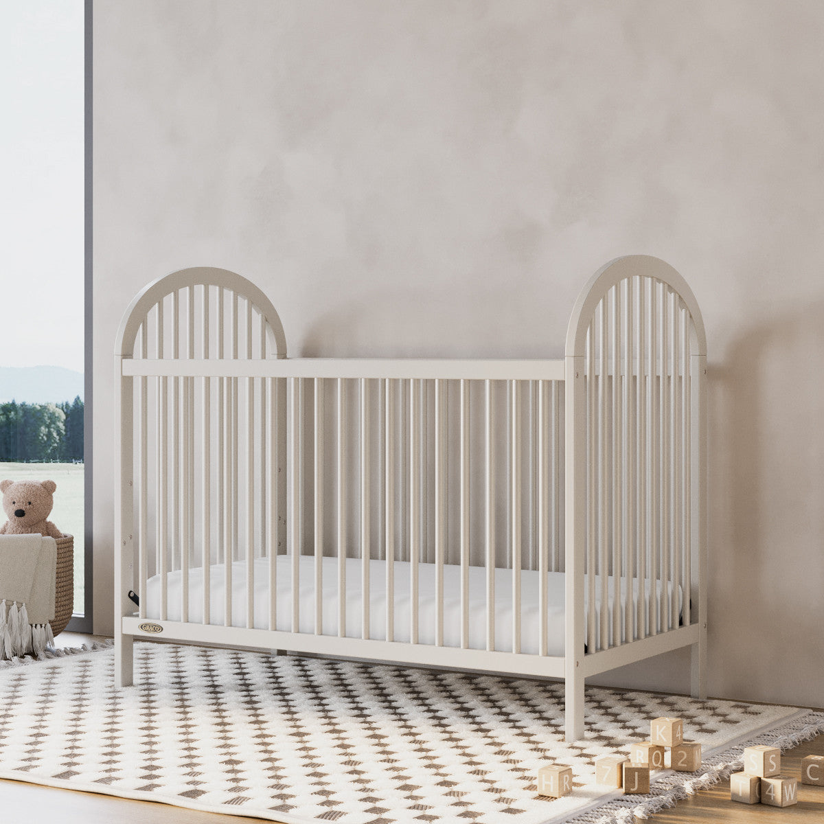 Olivia frosted oat crib in a nursery