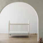 Olivia frosted oat crib in a nursery