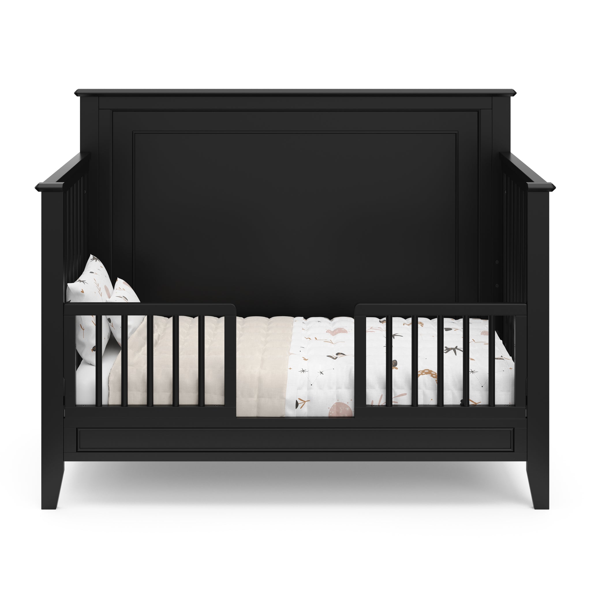 black crib in toddler bed conversion with two toddler safety guardrails