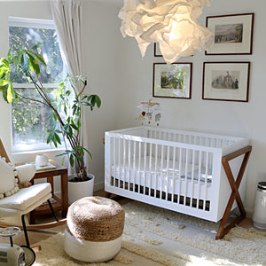 white and vintage driftwood crib in nursery