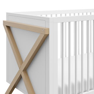 close up view of white with driftwood crib's side
