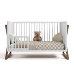 Equinox white with hazelnut crib converted to toddler bed with one guardrail