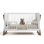 Equinox white with hazelnut crib converted to toddler bed with two guardrails