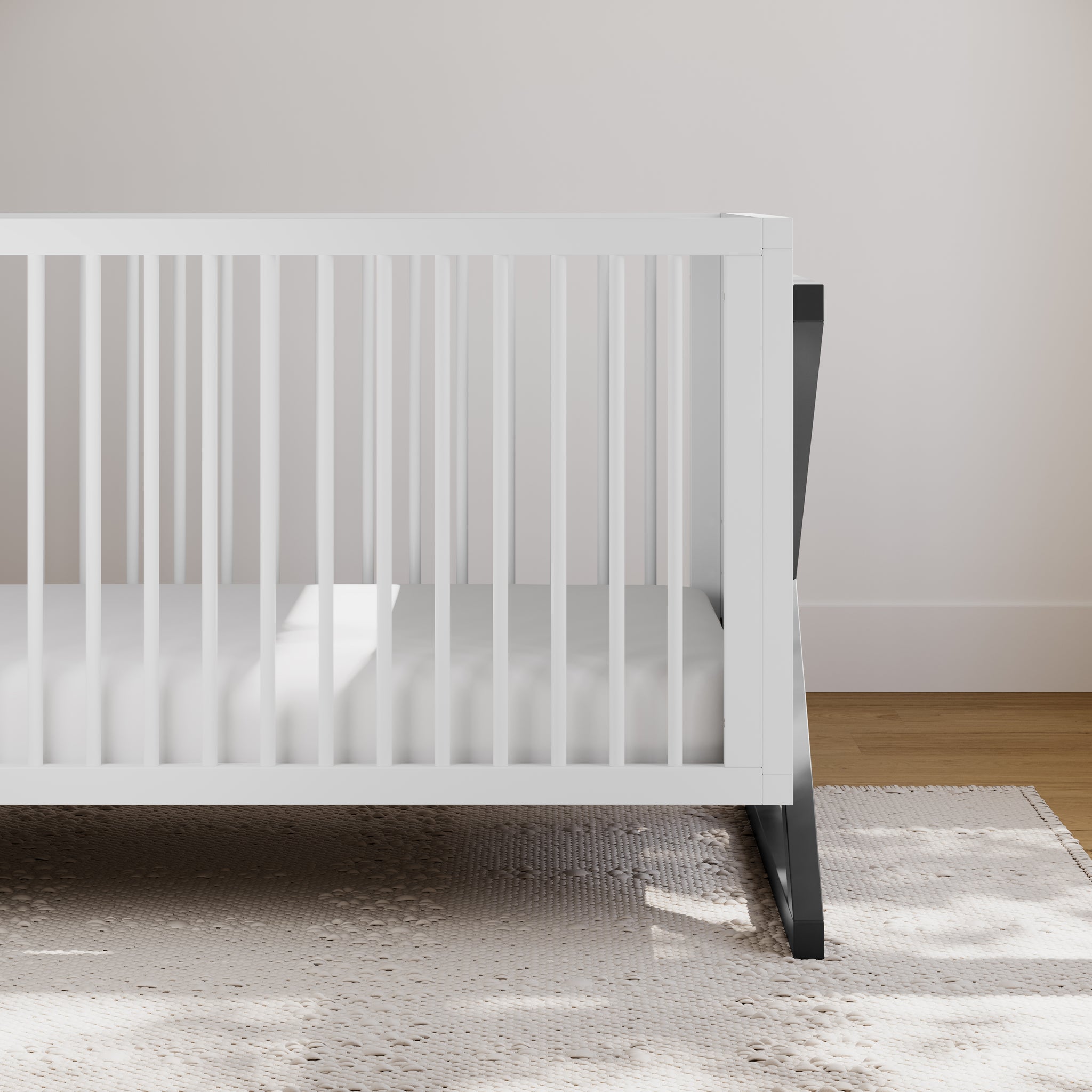 white with gray crib in nursery