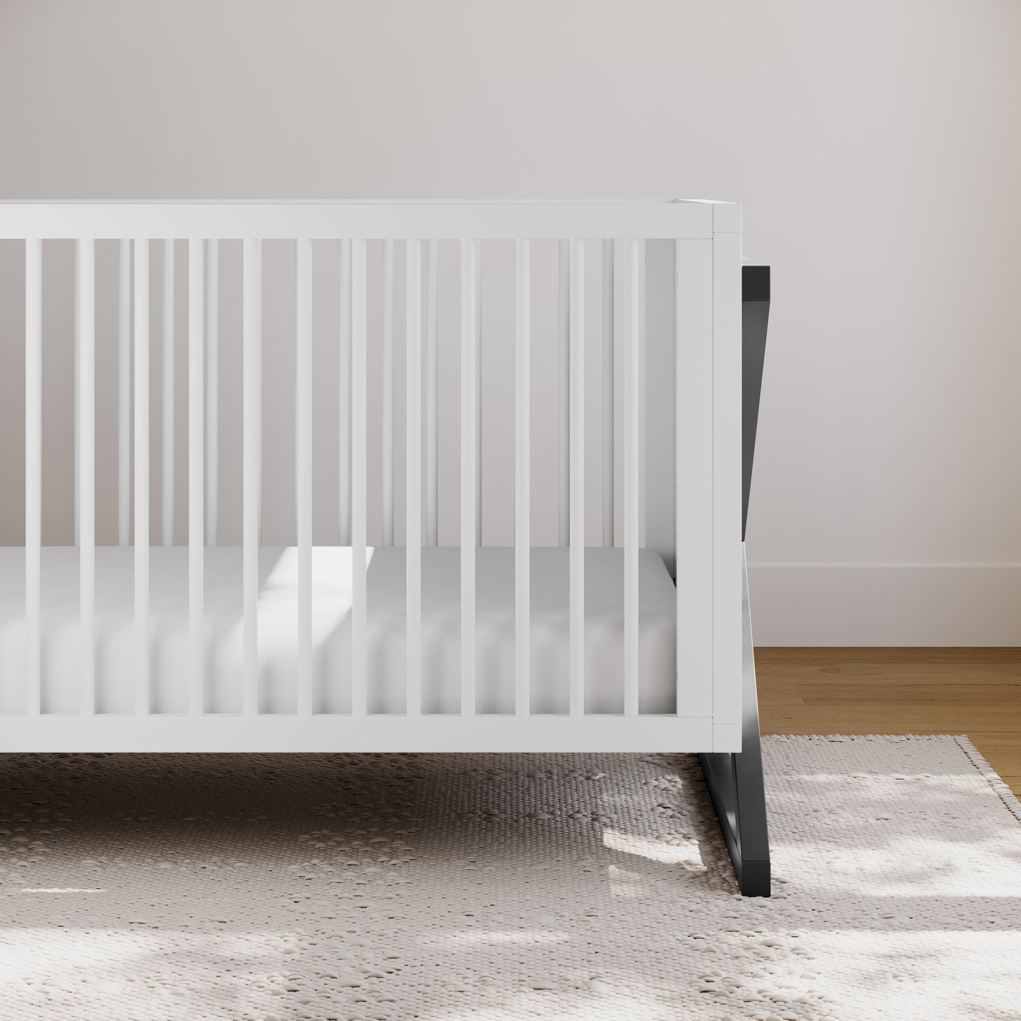 white with gray crib in nursery