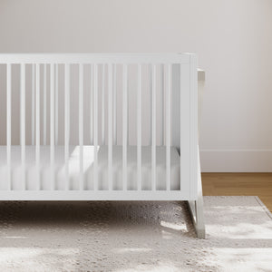 white with brushed fog crib in nursery
