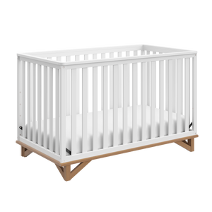 white crib with vintage driftwood angled