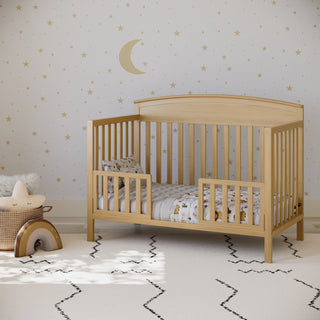 driftwood crib in toddler bed conversion with 2 toddler safety guardrails, in nursery